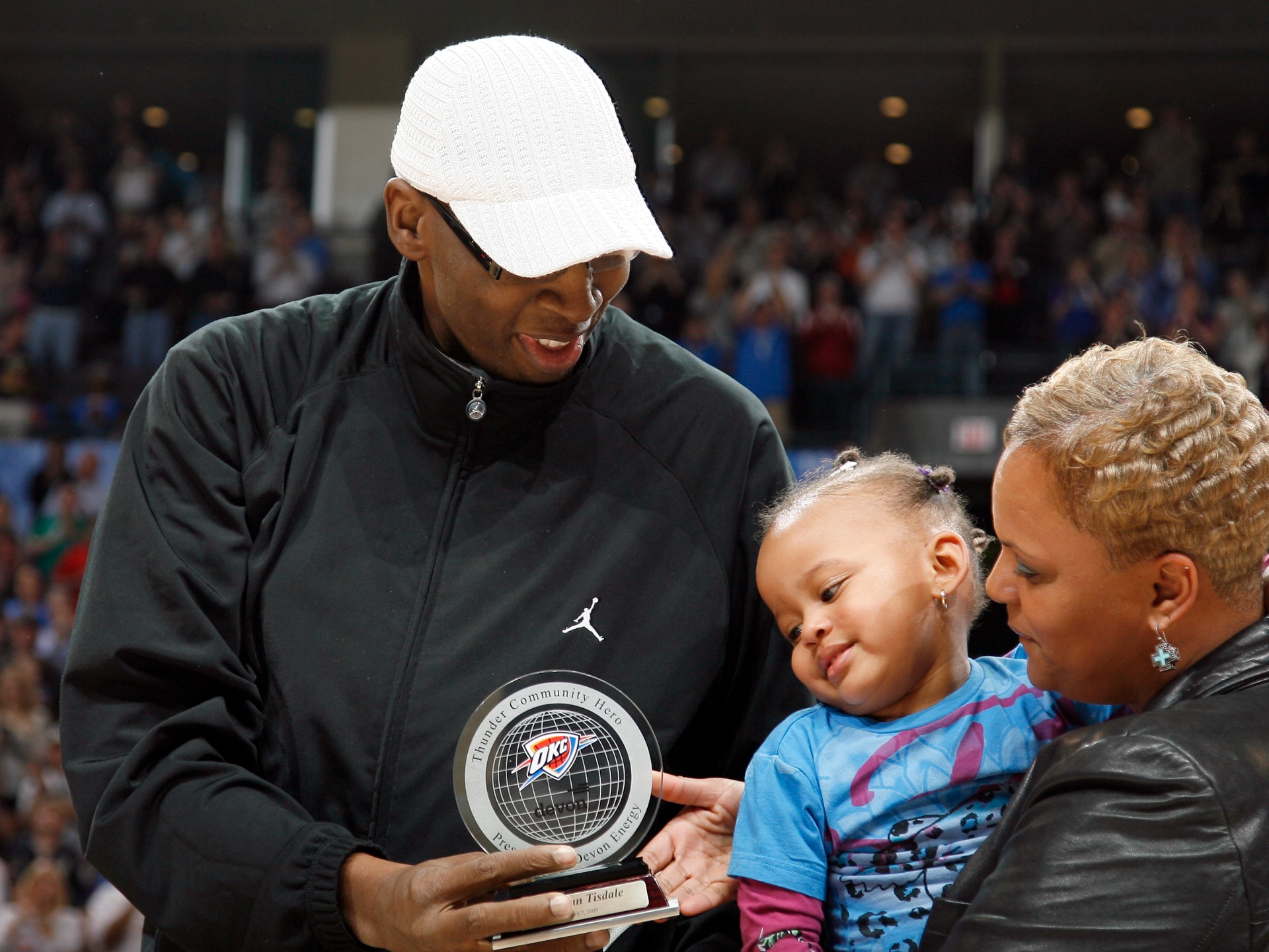 Wayman Tisdale being awarded the Thunder Community Hero award.  April 7, 2009. Courtesy Oklahoma Hall of Fame Archives.